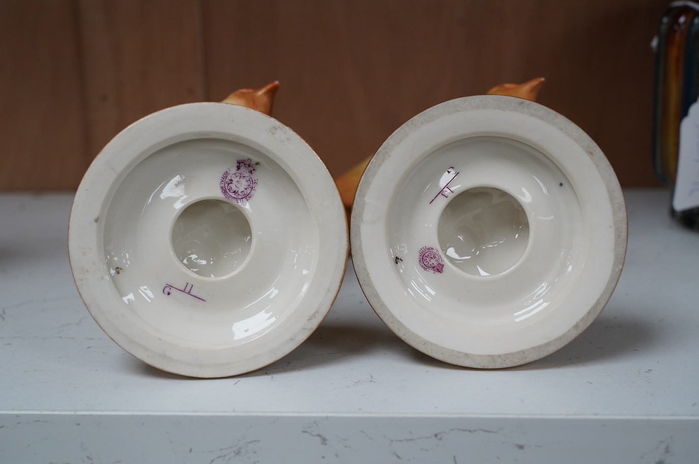 A pair of Royal Worcester blush ivory pot pourri, lacking covers, model number G11, height 9cm. Condition - good